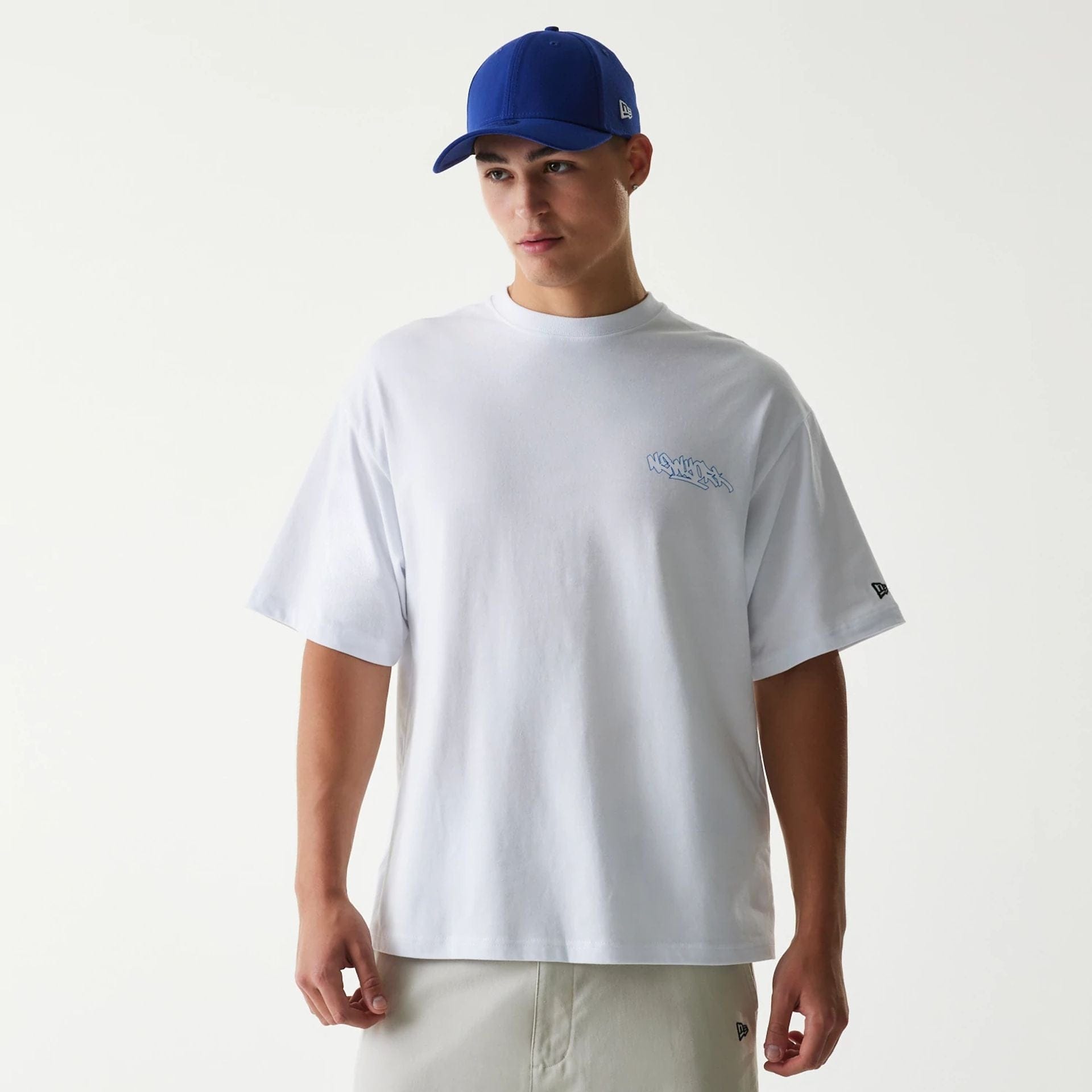 The Male model is wearing New Era Japan Tagging Logo White T-Shirt 1