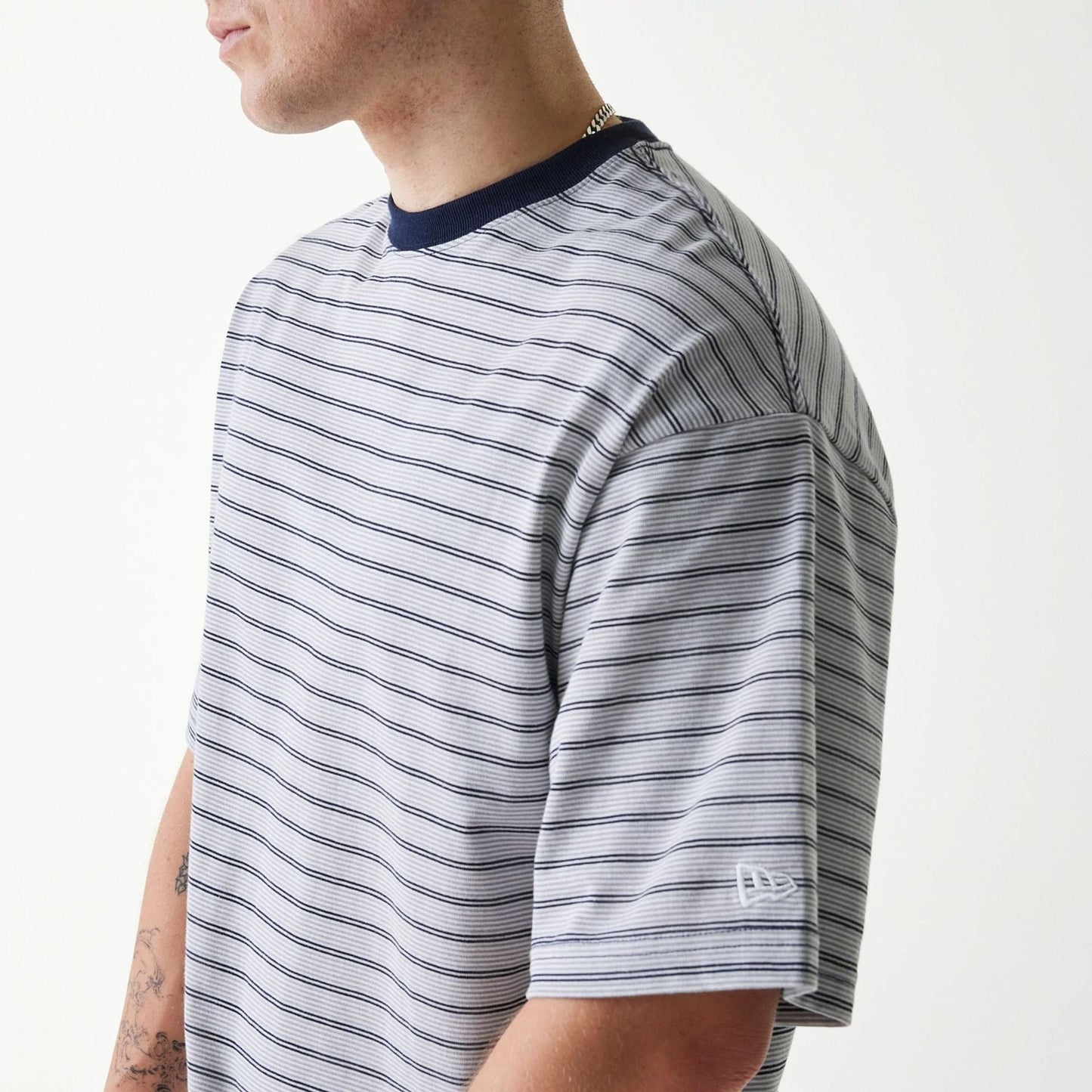 The Male model is wearing New Era Japan White T-Shirt 4