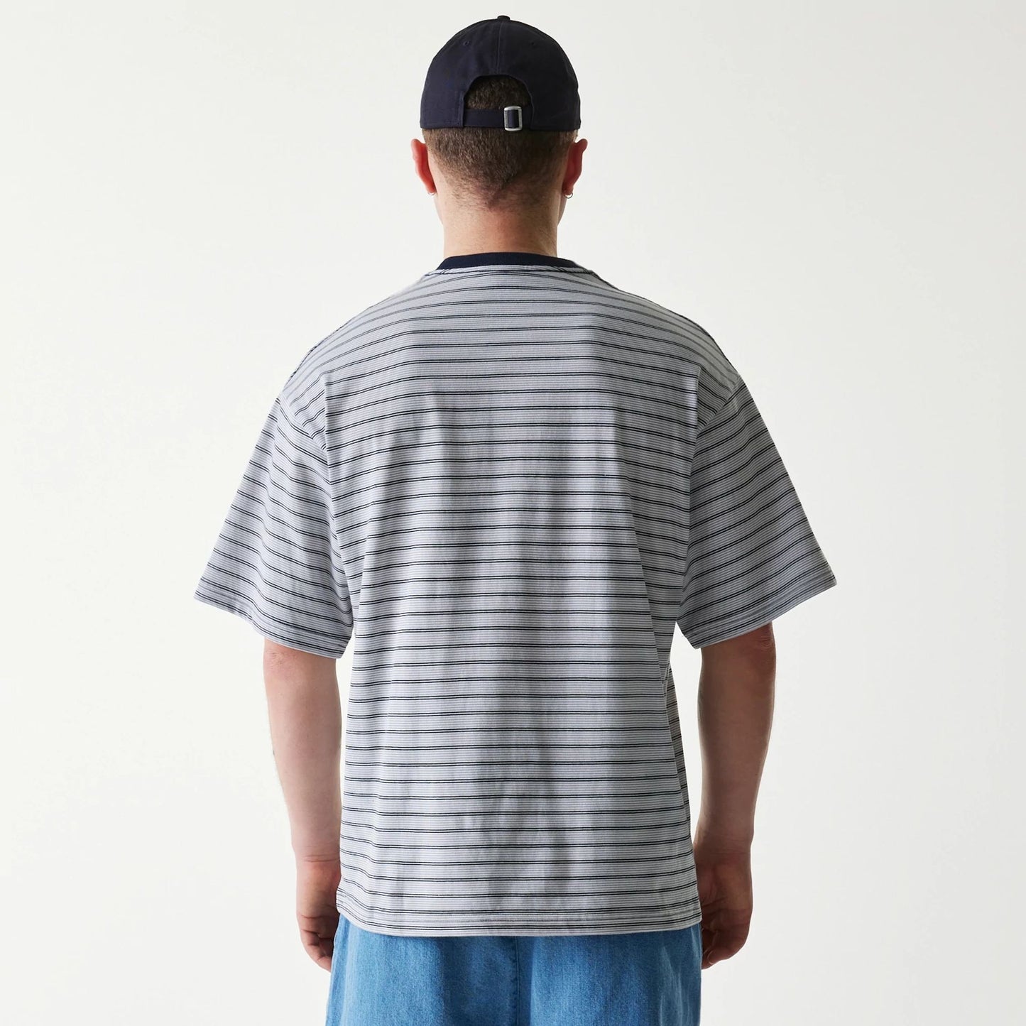 The Male model is wearing New Era Japan White T-Shirt 2