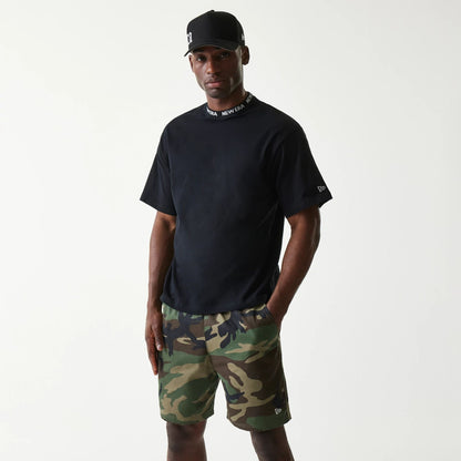 The Male model is wearing New Era Japan Neckband Logo Black T-Shirt 1