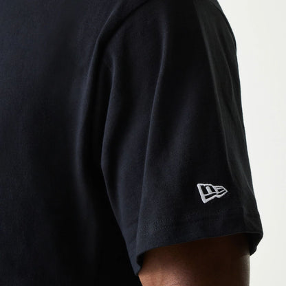 The Male model is wearing New Era Japan Neckband Logo Black T-Shirt 5