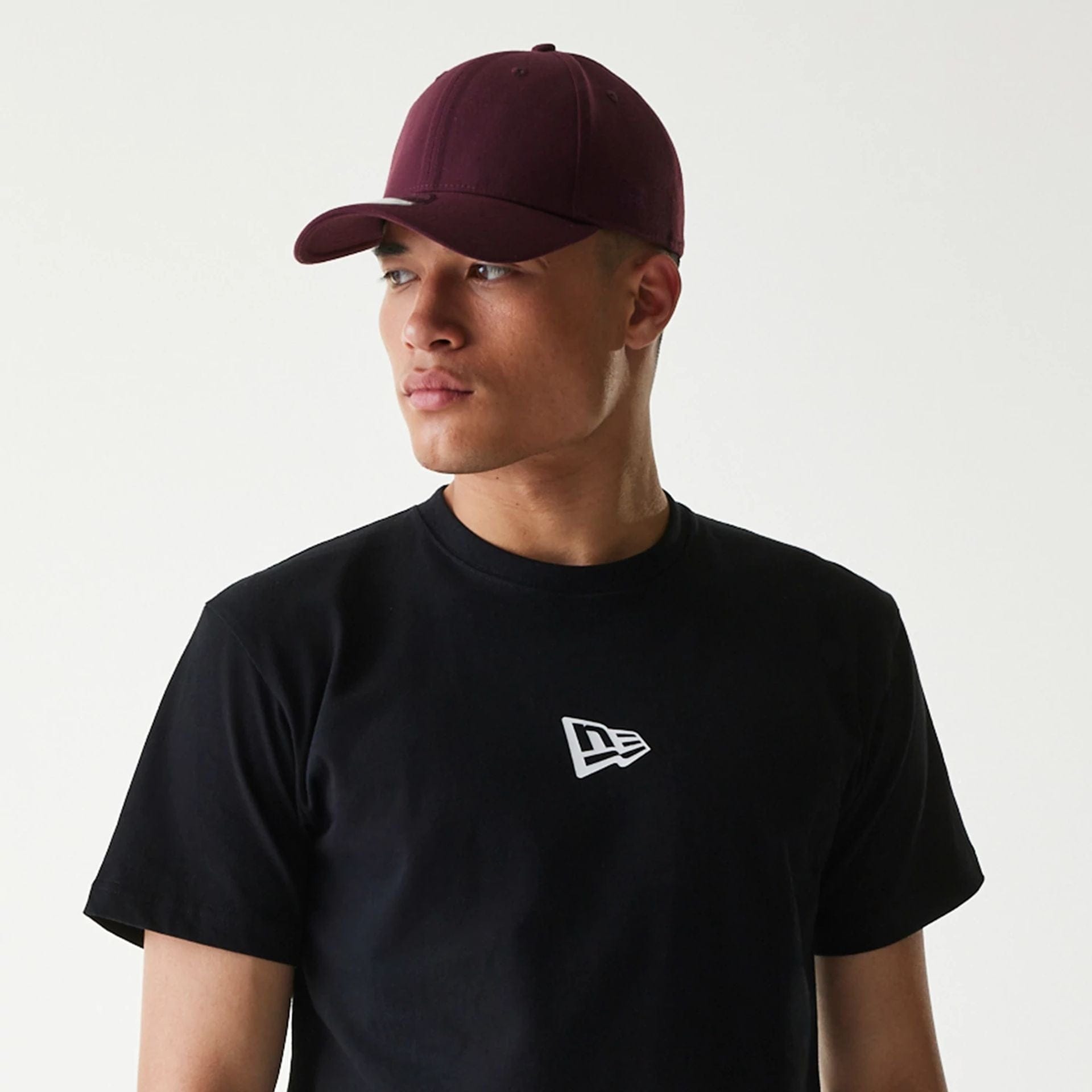 The Male model is wearing New Era Japan Mini Flag Logo Black T-Shirt 3