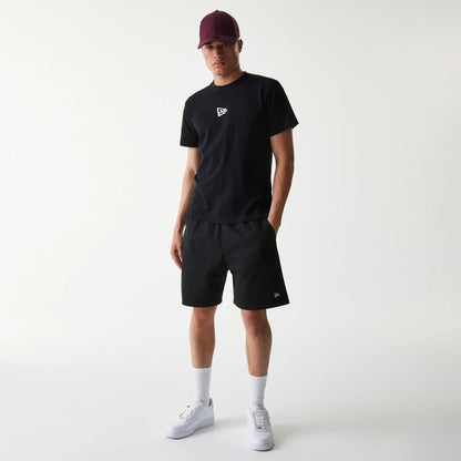 The Male model is wearing New Era Japan Mini Flag Logo Black T-Shirt 6
