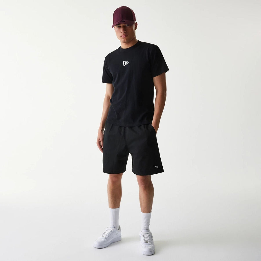 The Male model is wearing New Era Japan Mini Flag Logo Black T-Shirt 6