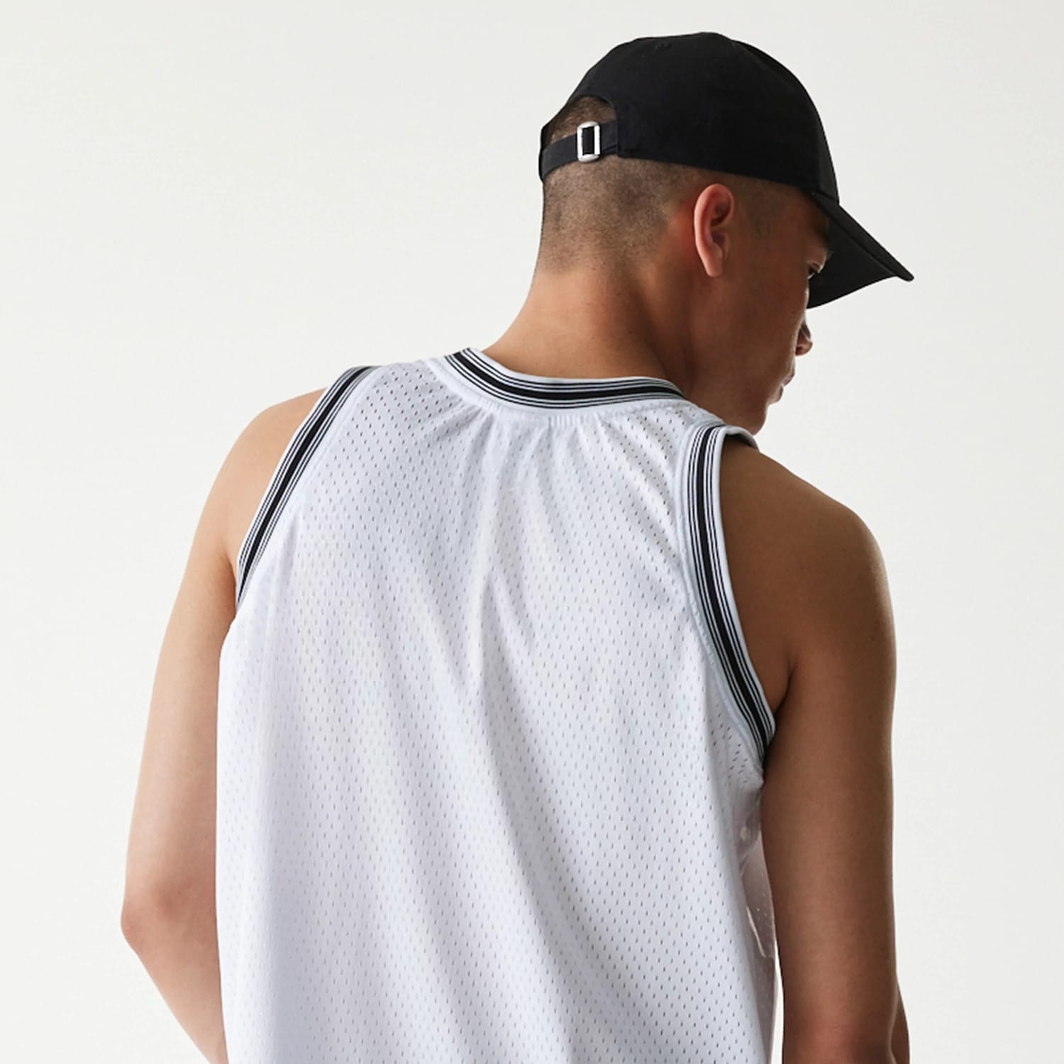 The Male model is wearing New Era Japan Mesh White Sleeveless T-Shirt 6