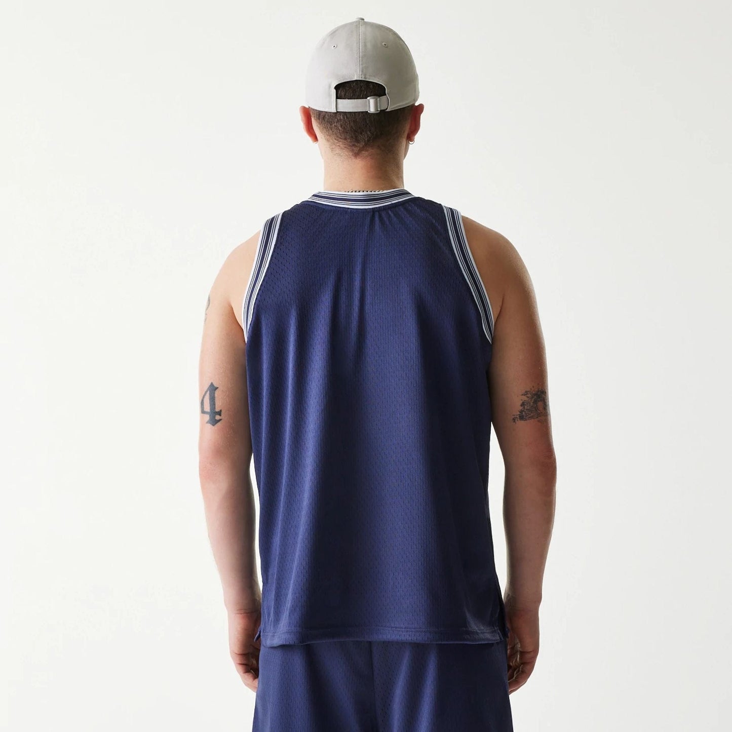The Male model is wearing New Era Japan Mesh Navy Sleeveless T-Shirt 2