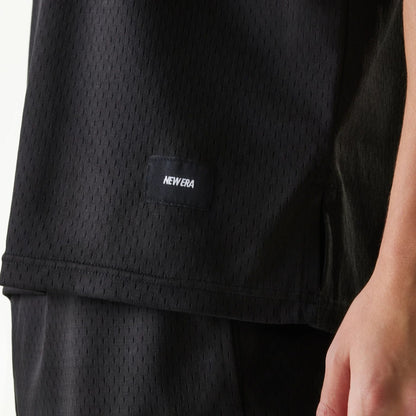 The Male model is wearing New Era Japan Mesh Black Sleeveless T-Shirt 4
