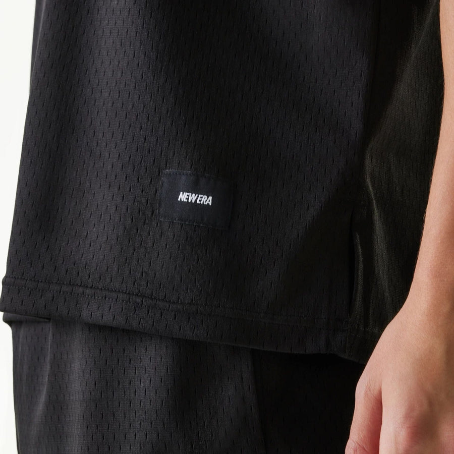 The Male model is wearing New Era Japan Mesh Black Sleeveless T-Shirt 4