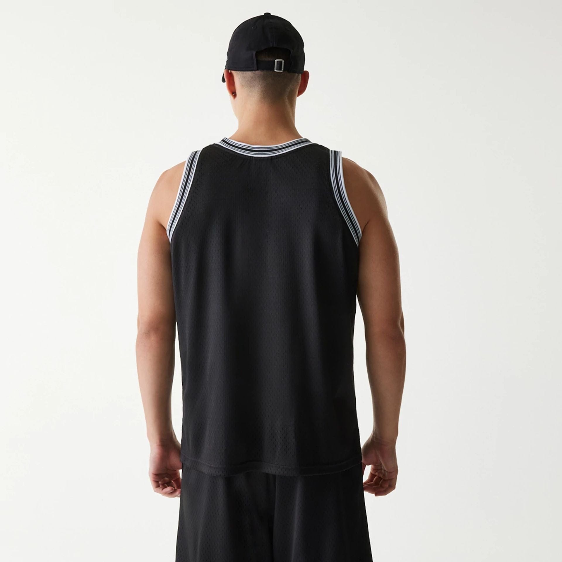 The Male model is wearing New Era Japan Mesh Black Sleeveless T-Shirt 2