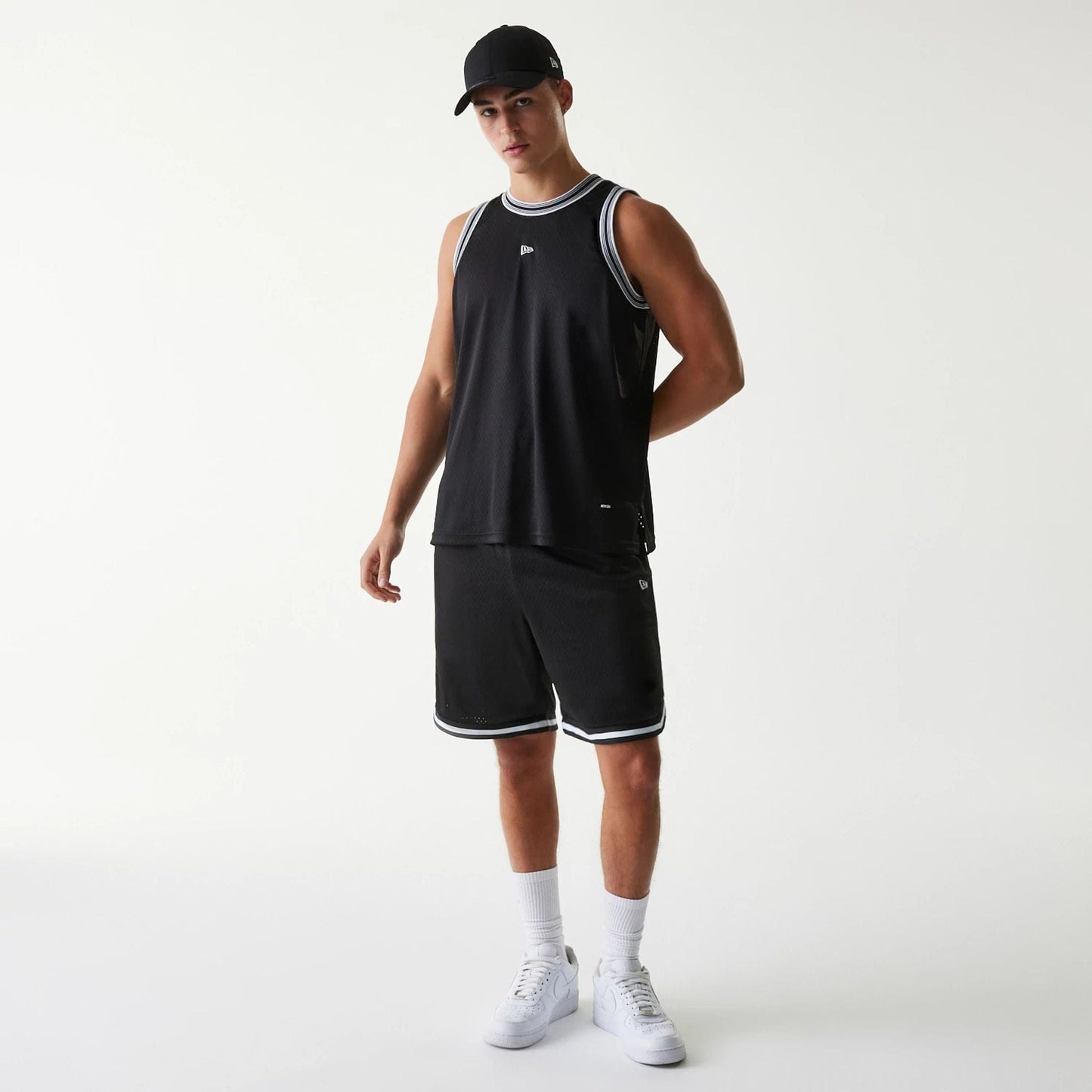 The Male model is wearing New Era Japan Mesh Black Sleeveless T-Shirt 7