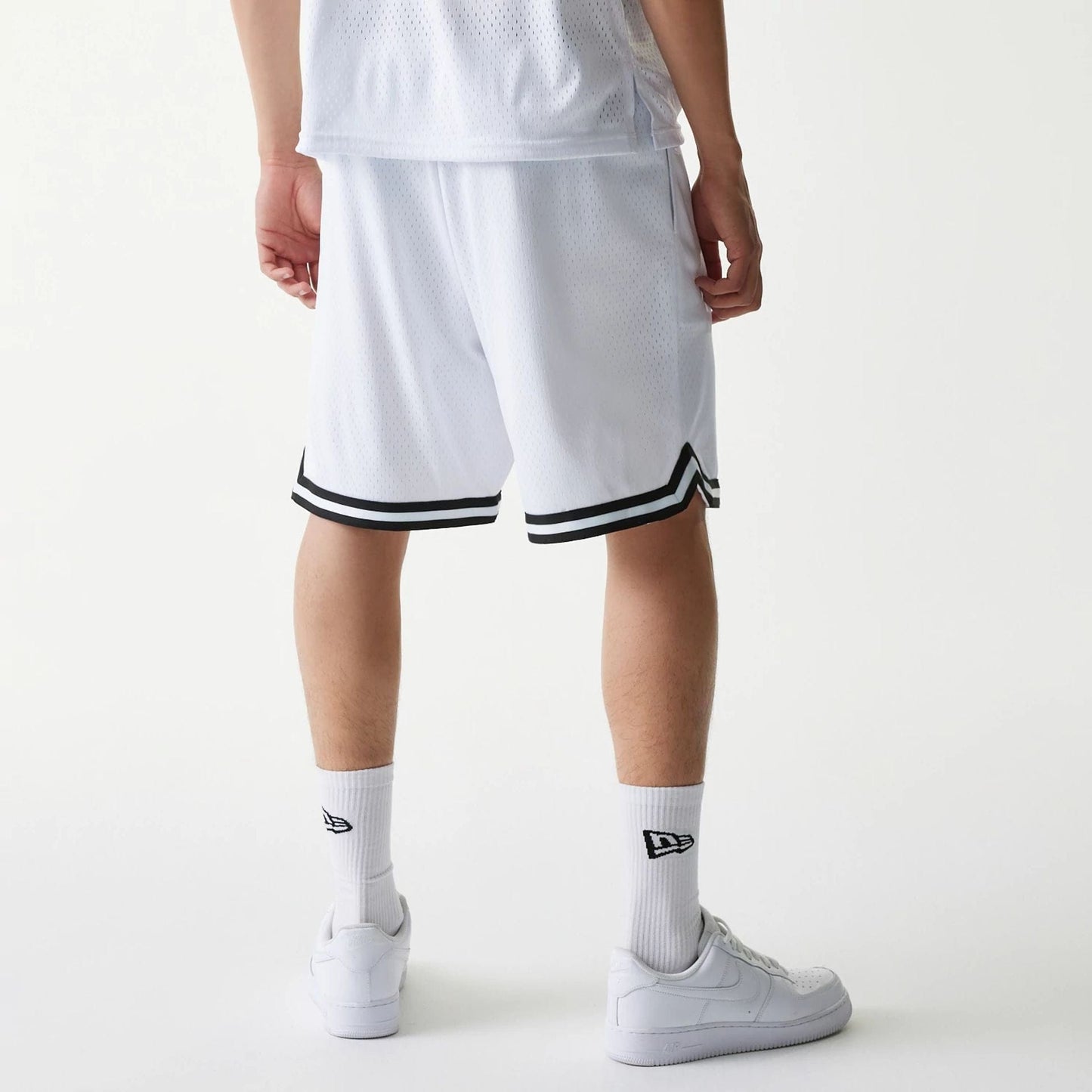 The Male model is wearing New Era Japan Mesh White Shorts 2