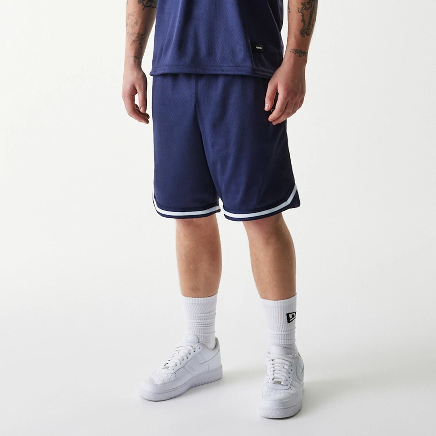 The Male model is wearing New Era Japan Mesh Navy Shorts 6