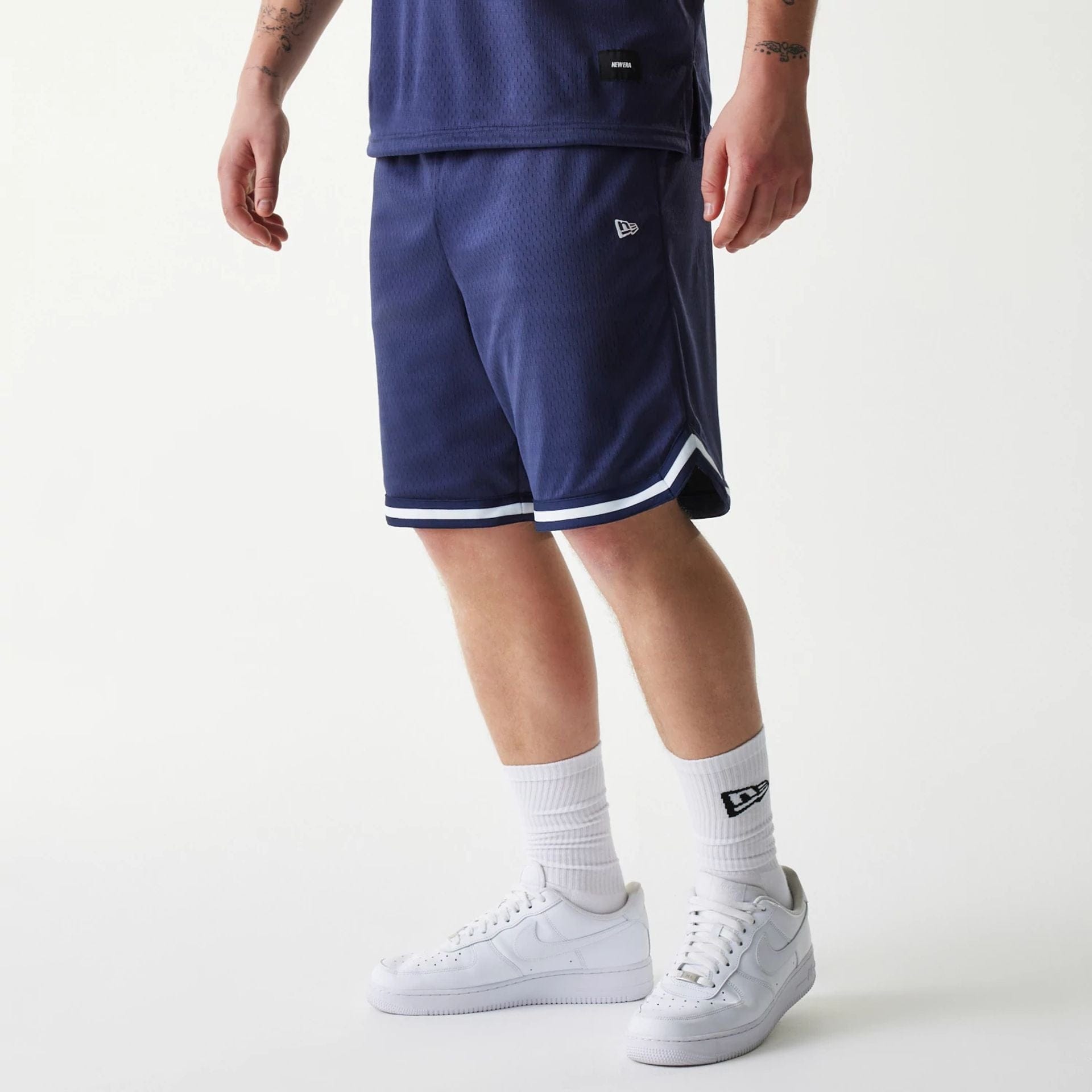 The Male model is wearing New Era Japan Mesh Navy Shorts 1