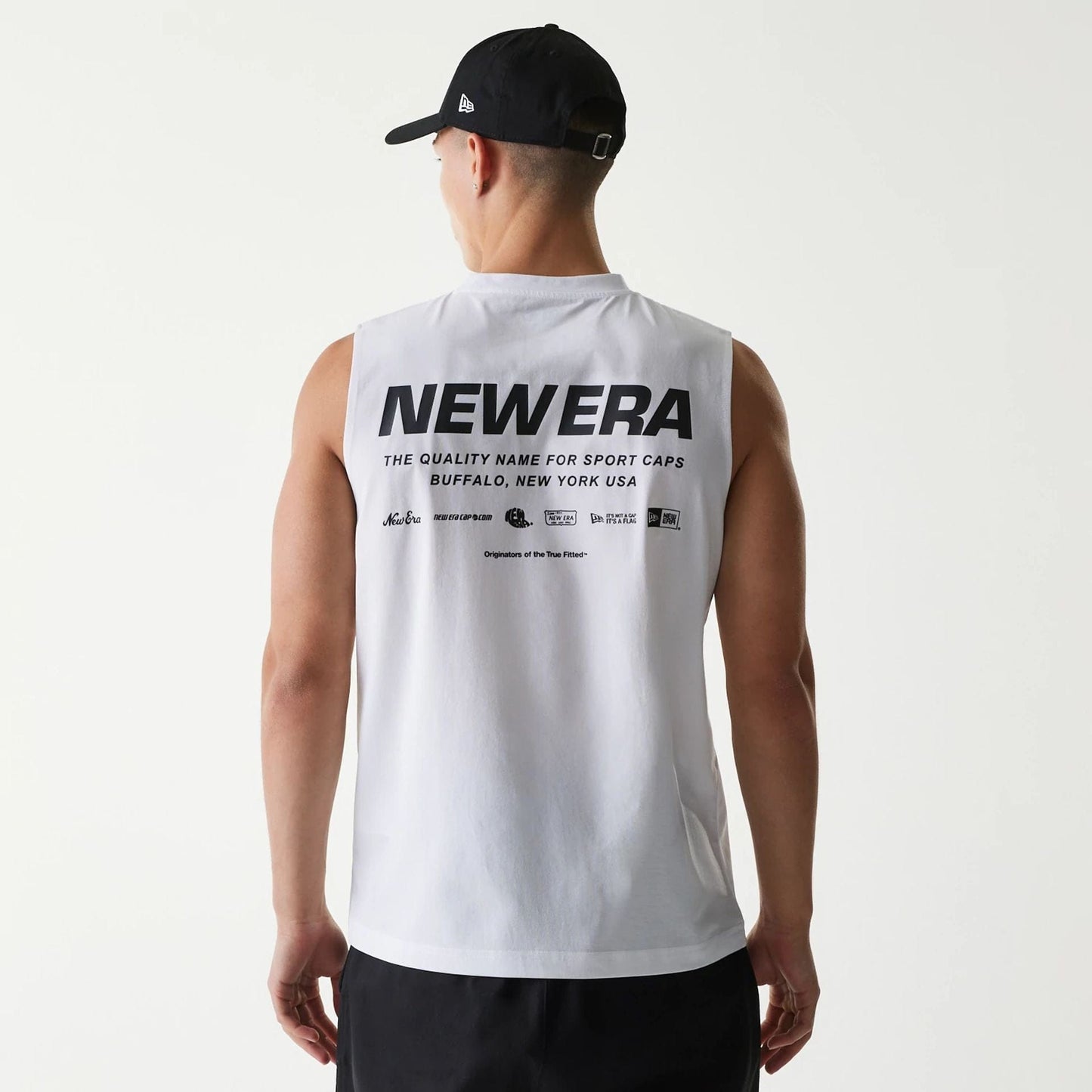 The Male model is wearing New Era Japan White Sleeveless T-Shirt 2