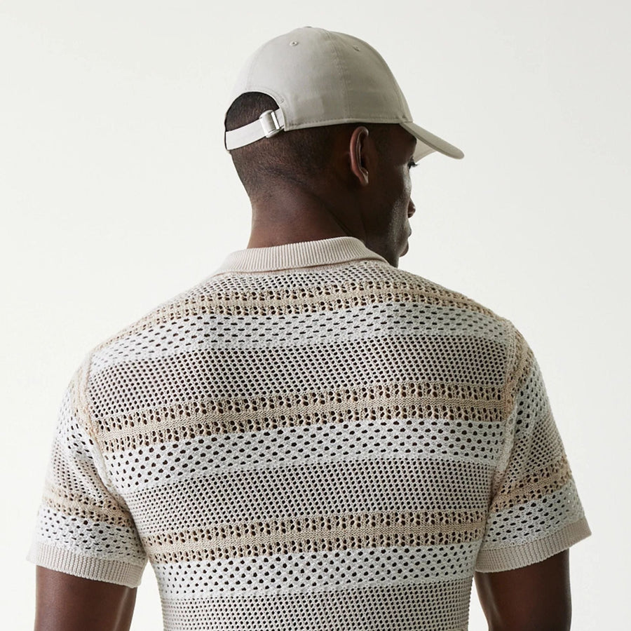 The Male model is wearing New Era Japan Mesh White Polo T-Shirt 5