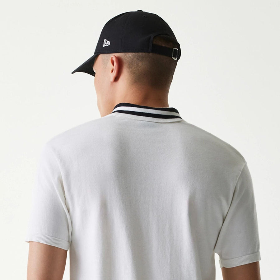 The Male model is wearing New Era Japan White Polo T-Shirt 5