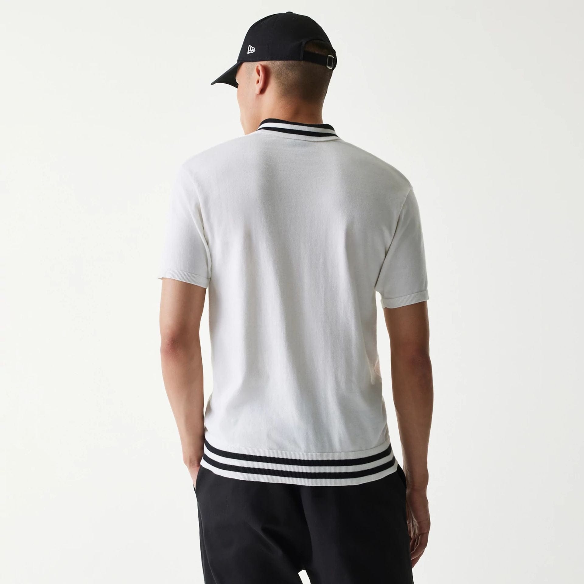 The Male model is wearing New Era Japan White Polo T-Shirt 2