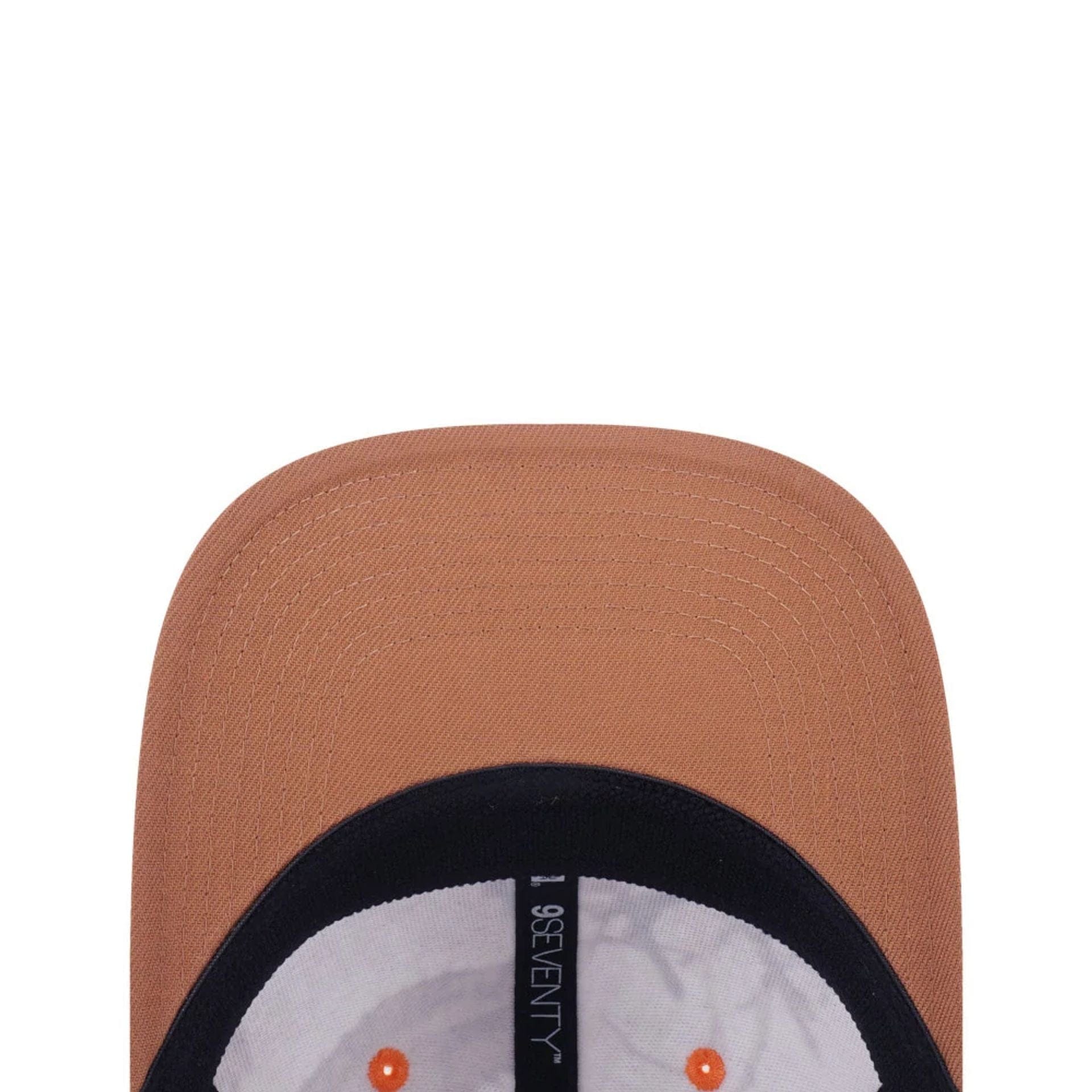 This is a New Era Earthy Skin Real Tree Snow 9SEVENTY Stretch Snap Adjustable Cap 5