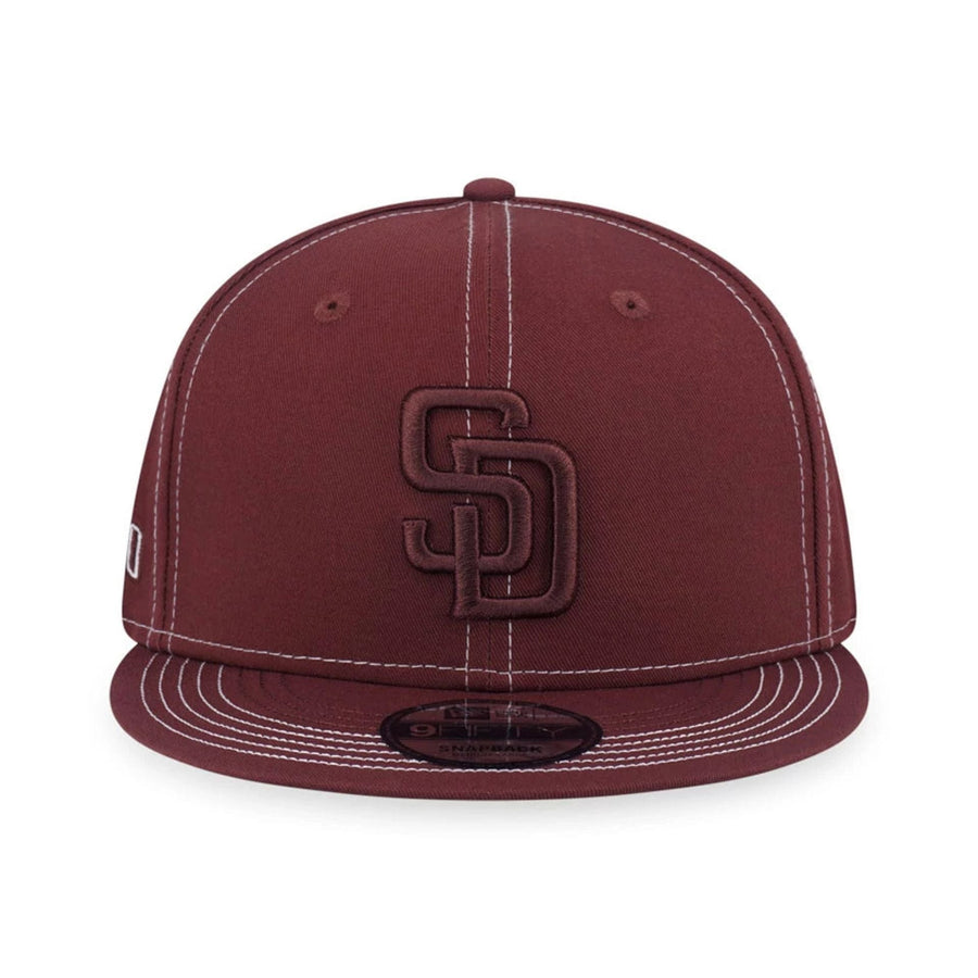 Pictured is this MLB Contrast Stitching San Diego Padres 9FIFTY Snapback cap in brown. 2