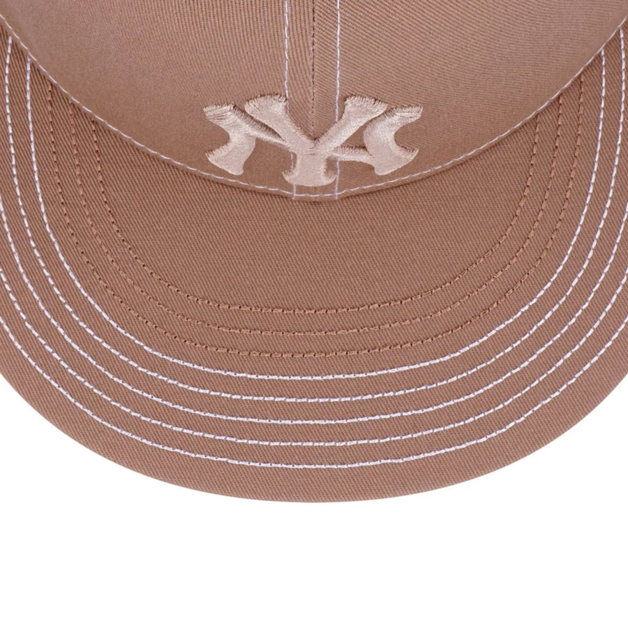 Pictured is this MLB Contrast Stitching New York Yankees 9FIFTY Snapback cap in beige. 4