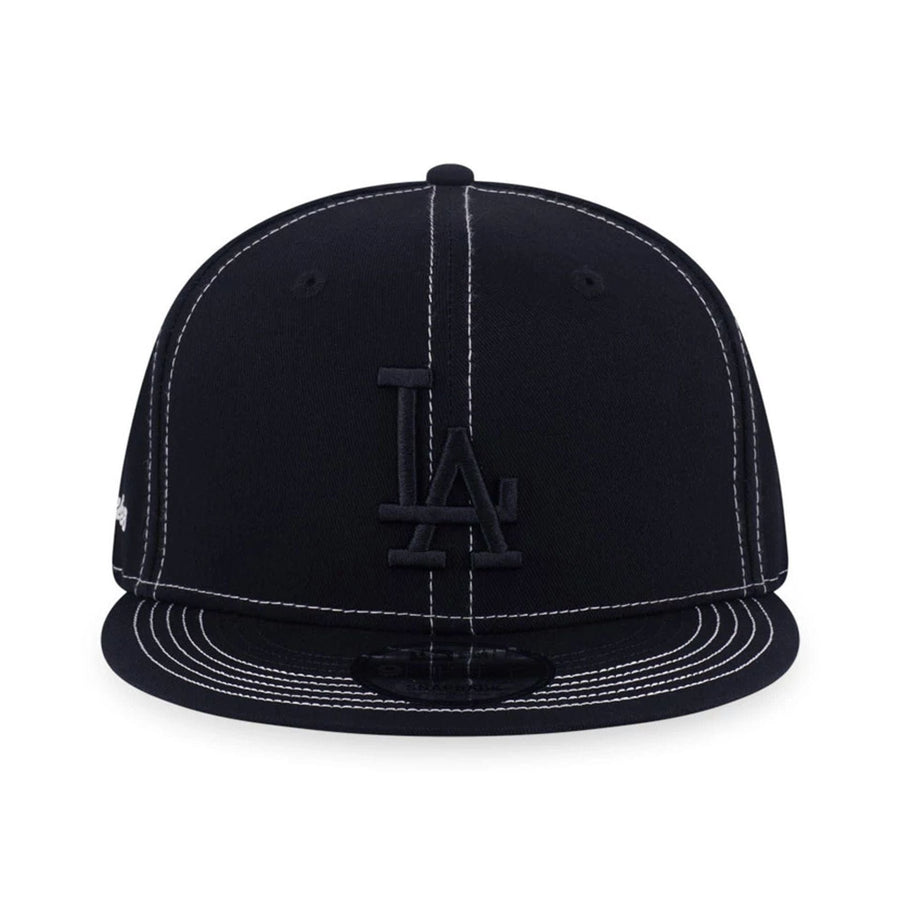 Pictured is this MLB Contrast Stitching LA Dodgers 9FIFTY Snapback cap in black. 2