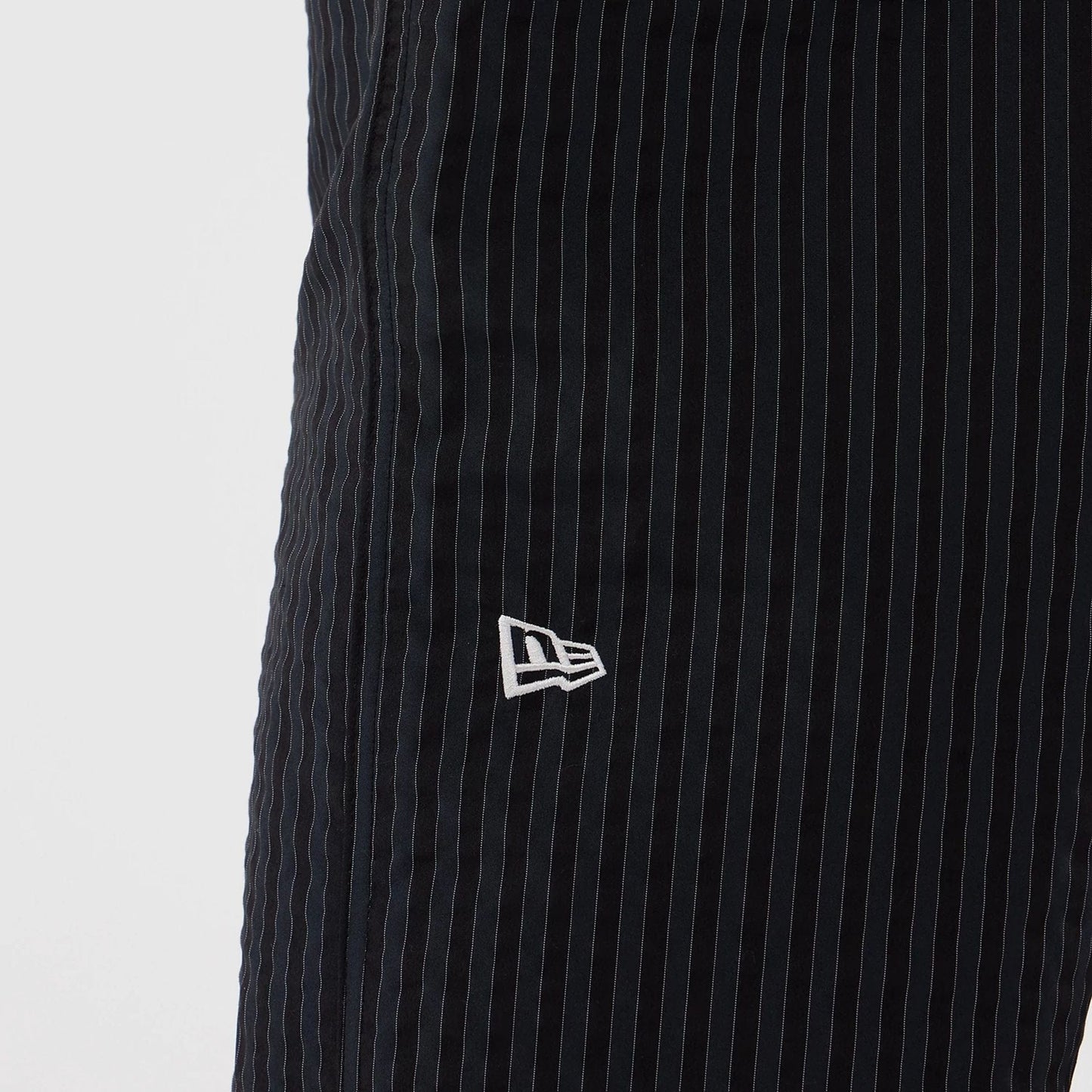 The model is wearing these New Era Street Class straight leg joggers in navy. 3