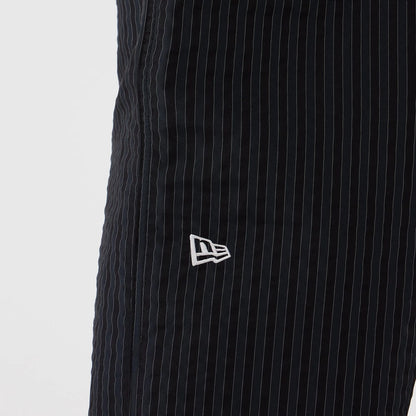 The model is wearing these New Era Street Class straight leg joggers in navy. 3