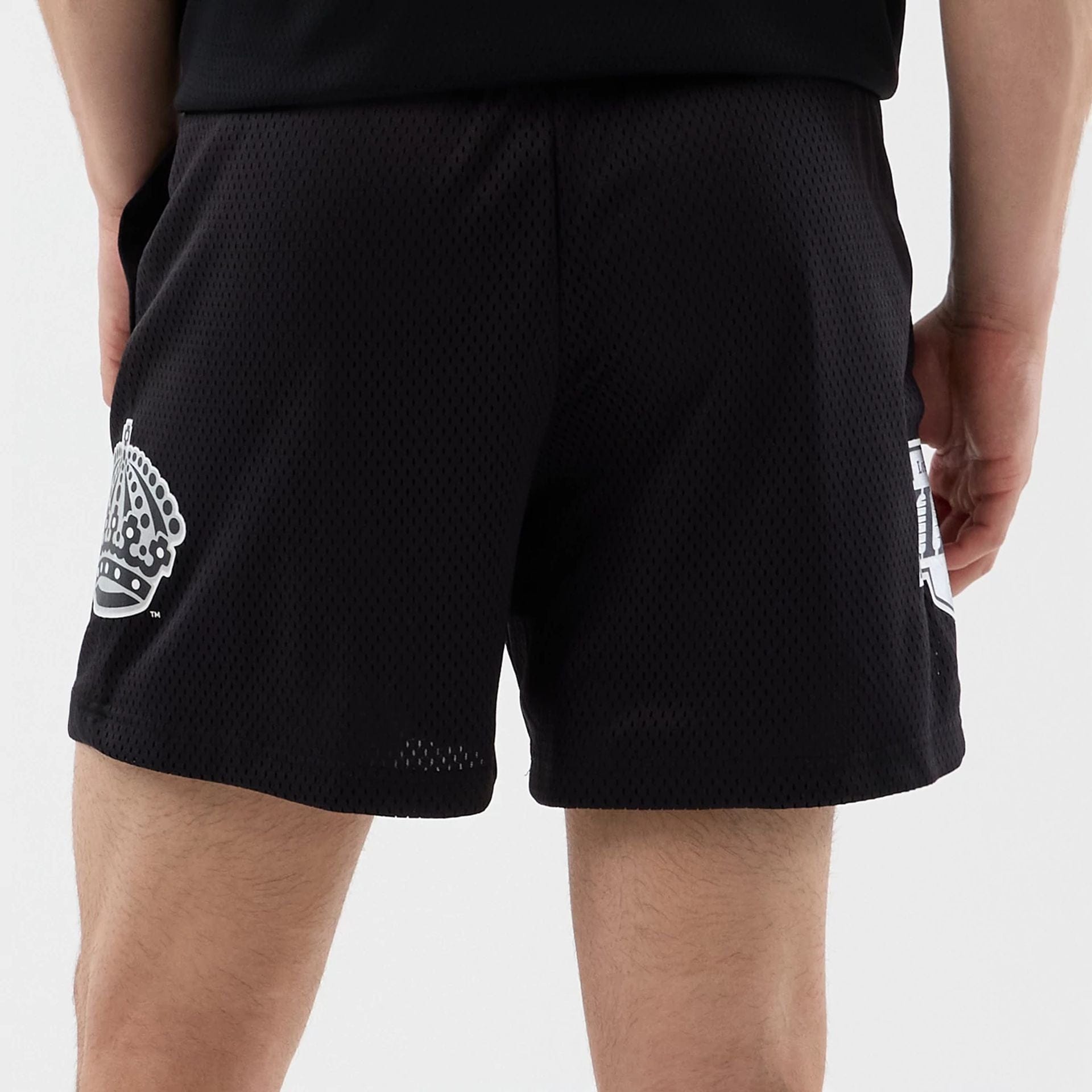 The Male model is wearing LA Kings NHL Street Culture Black Oversized Shorts  6