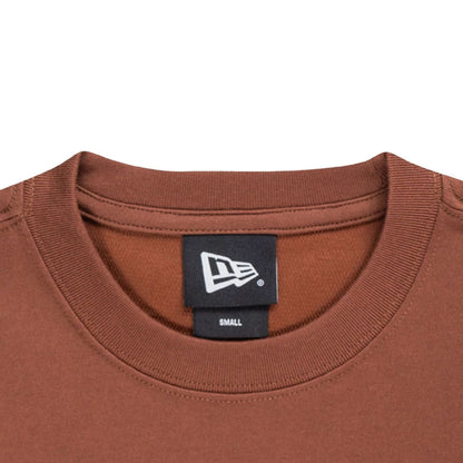 The model is wearing this New Era Mountain Logo T-Shirt in Open Brown. 3
