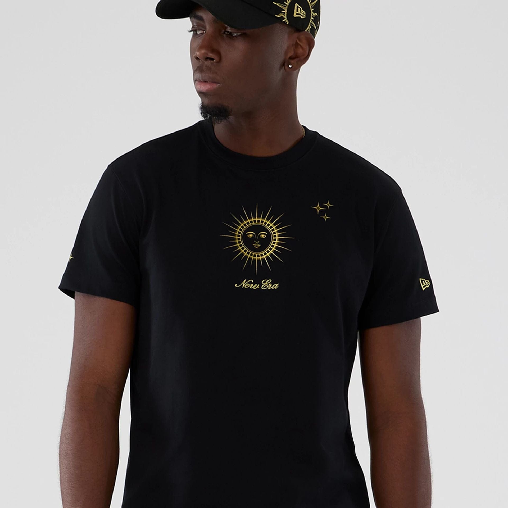 The model is wearing this New Era Cosmic Craft T-Shirt in black. 7