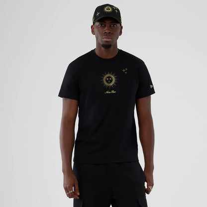 The model is wearing this New Era Cosmic Craft T-Shirt in black. 1
