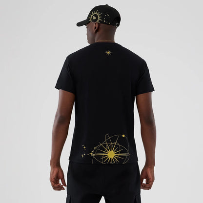 The model is wearing this New Era Cosmic Craft T-Shirt in black. 2