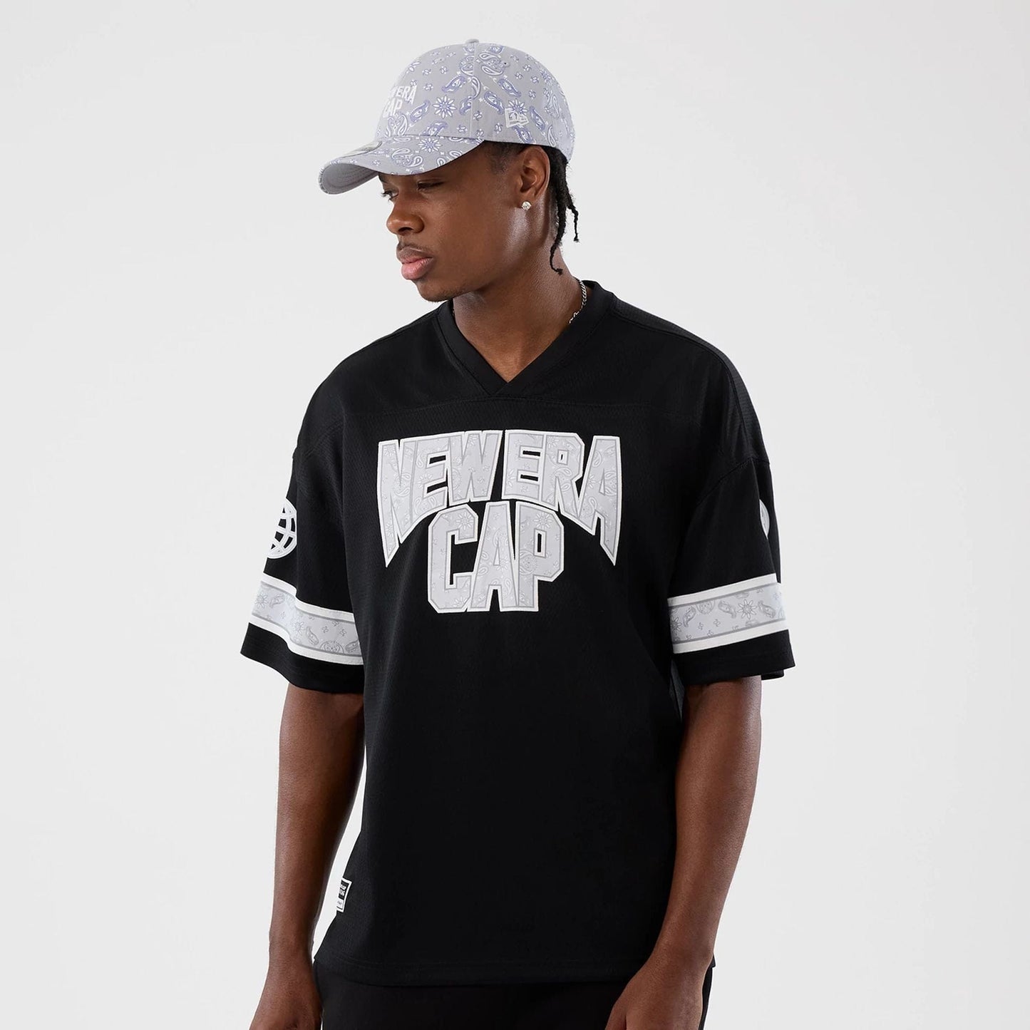 The Male model is wearing  New Era Street Swing Black T-Shirt  7