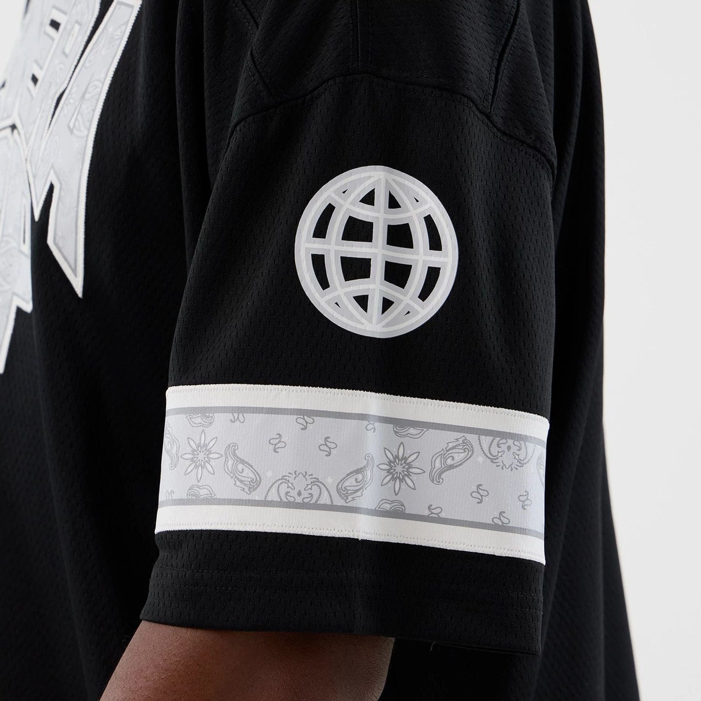 The Male model is wearing  New Era Street Swing Black T-Shirt  6