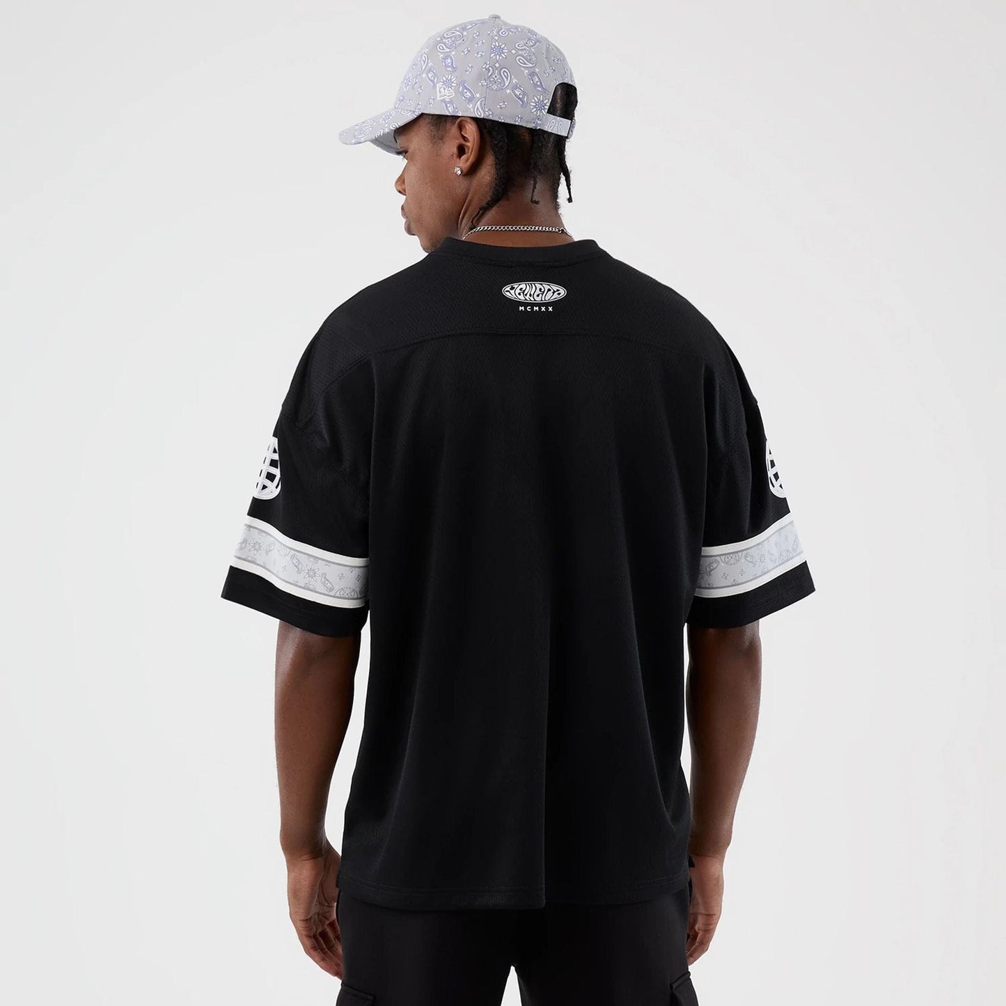 The Male model is wearing  New Era Street Swing Black T-Shirt  2