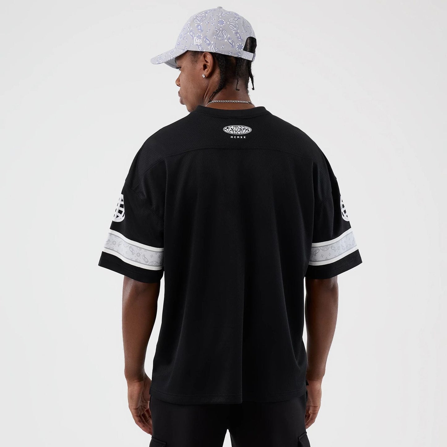 The Male model is wearing  New Era Street Swing Black T-Shirt 2
