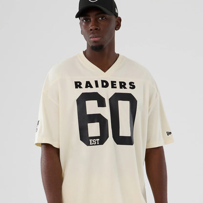 The model is wearing this NFL Historic Las Vegas Raiders Oversized T-Shirt in cream. 7