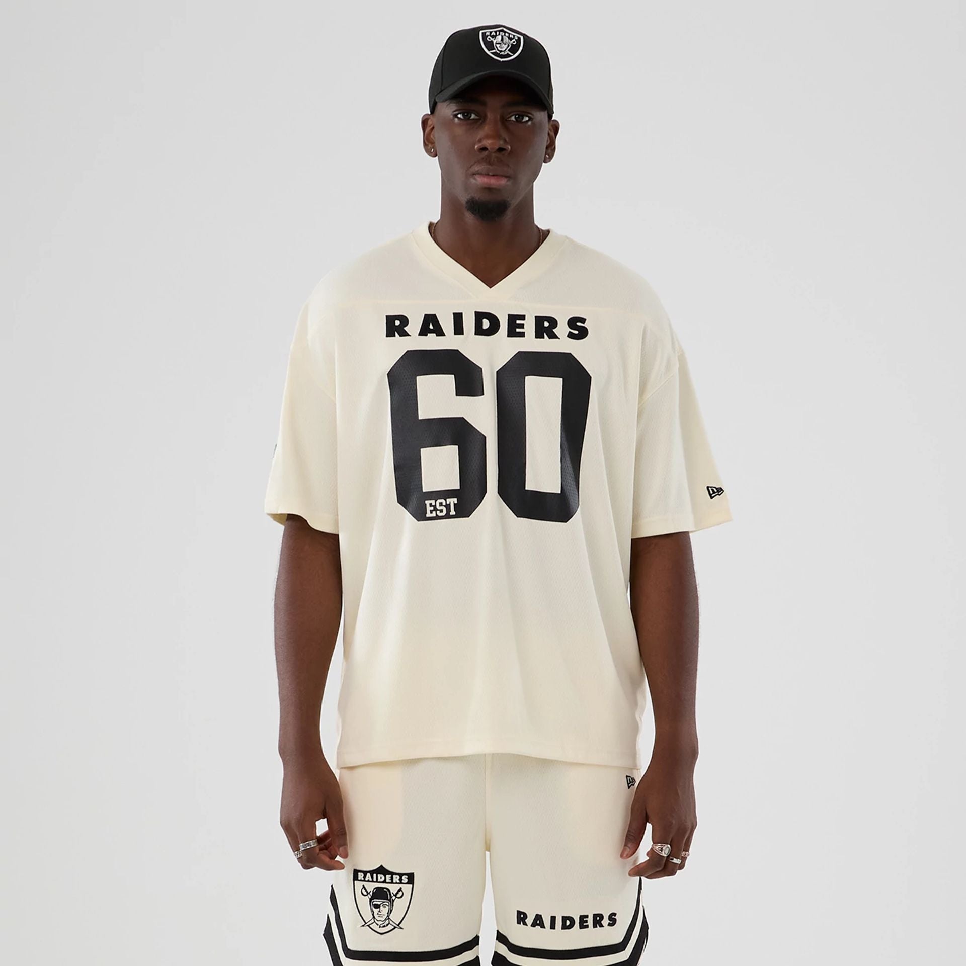 The model is wearing this NFL Historic Las Vegas Raiders Oversized T-Shirt in cream. 1
