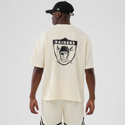 The model is wearing this NFL Historic Las Vegas Raiders Oversized T-Shirt in cream. 2