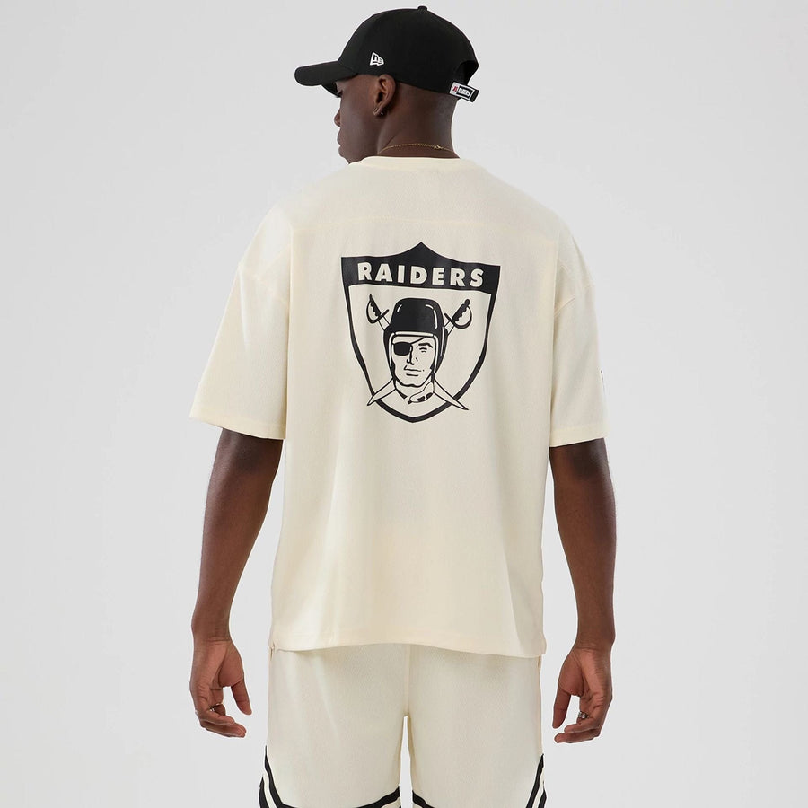 The model is wearing this NFL Historic Las Vegas Raiders Oversized T-Shirt in cream. 2