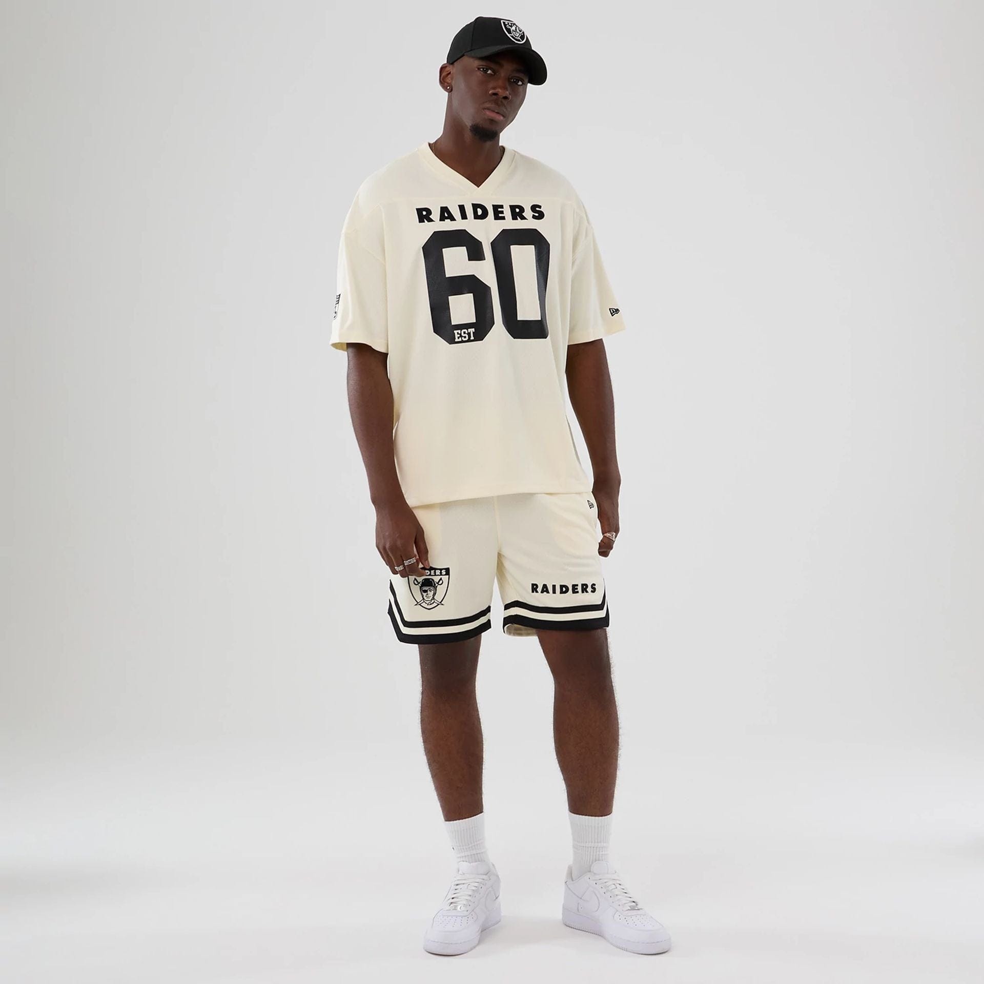 The model is wearing this NFL Historic Las Vegas Raiders Oversized T-Shirt in cream. 8