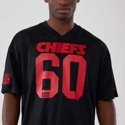 The model is wearing this NFL Historic Kansas City Chiefs Oversized T-Shirt in black. 3