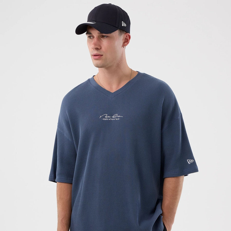 The Male model is wearing New Era Basic Blue T-Shirt 5