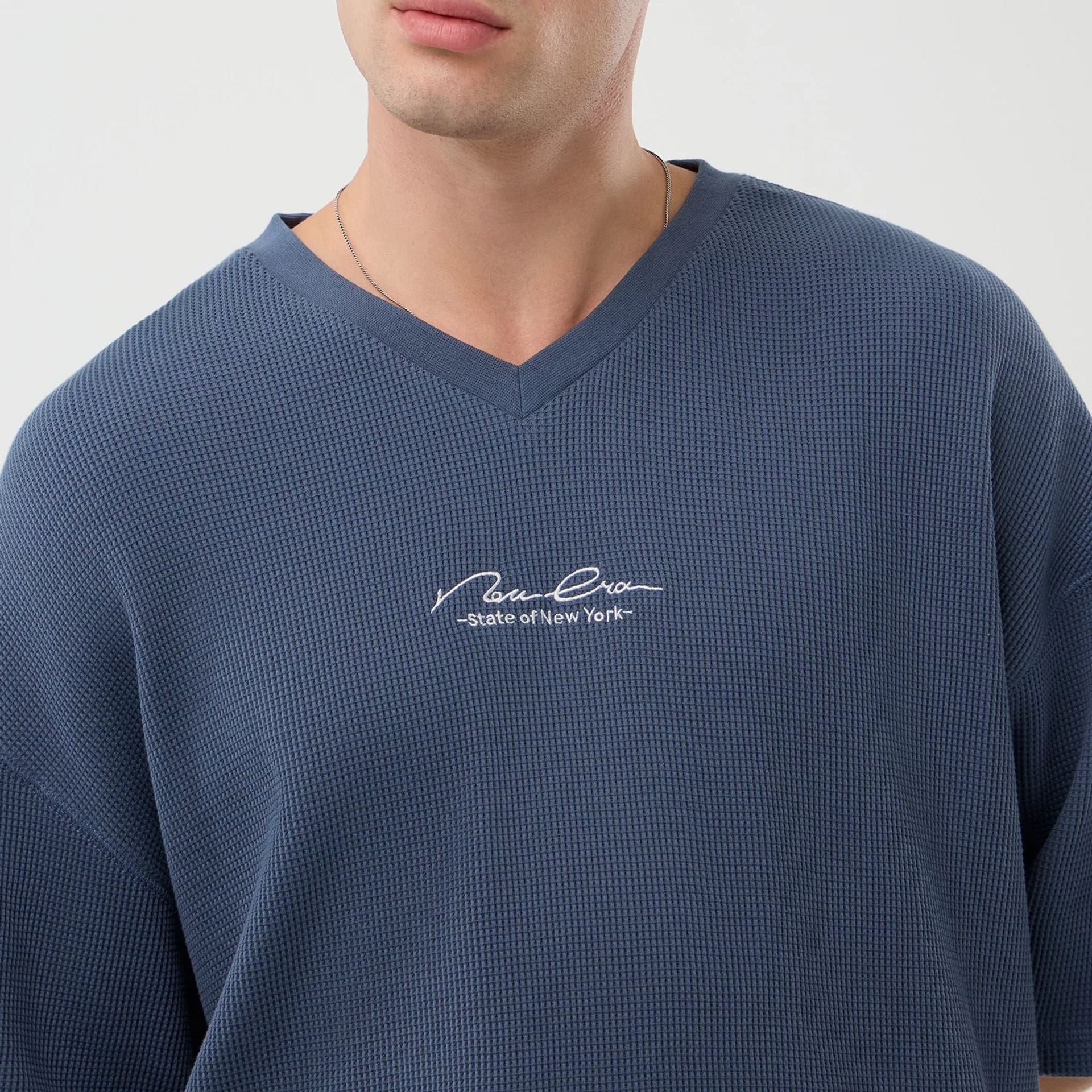 The Male model is wearing New Era Basic Blue T-Shirt 6