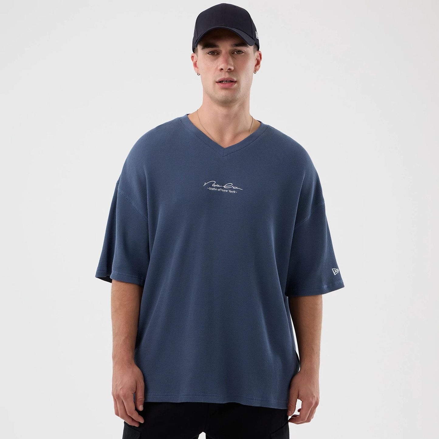 The Male model is wearing New Era Basic Blue T-Shirt 1