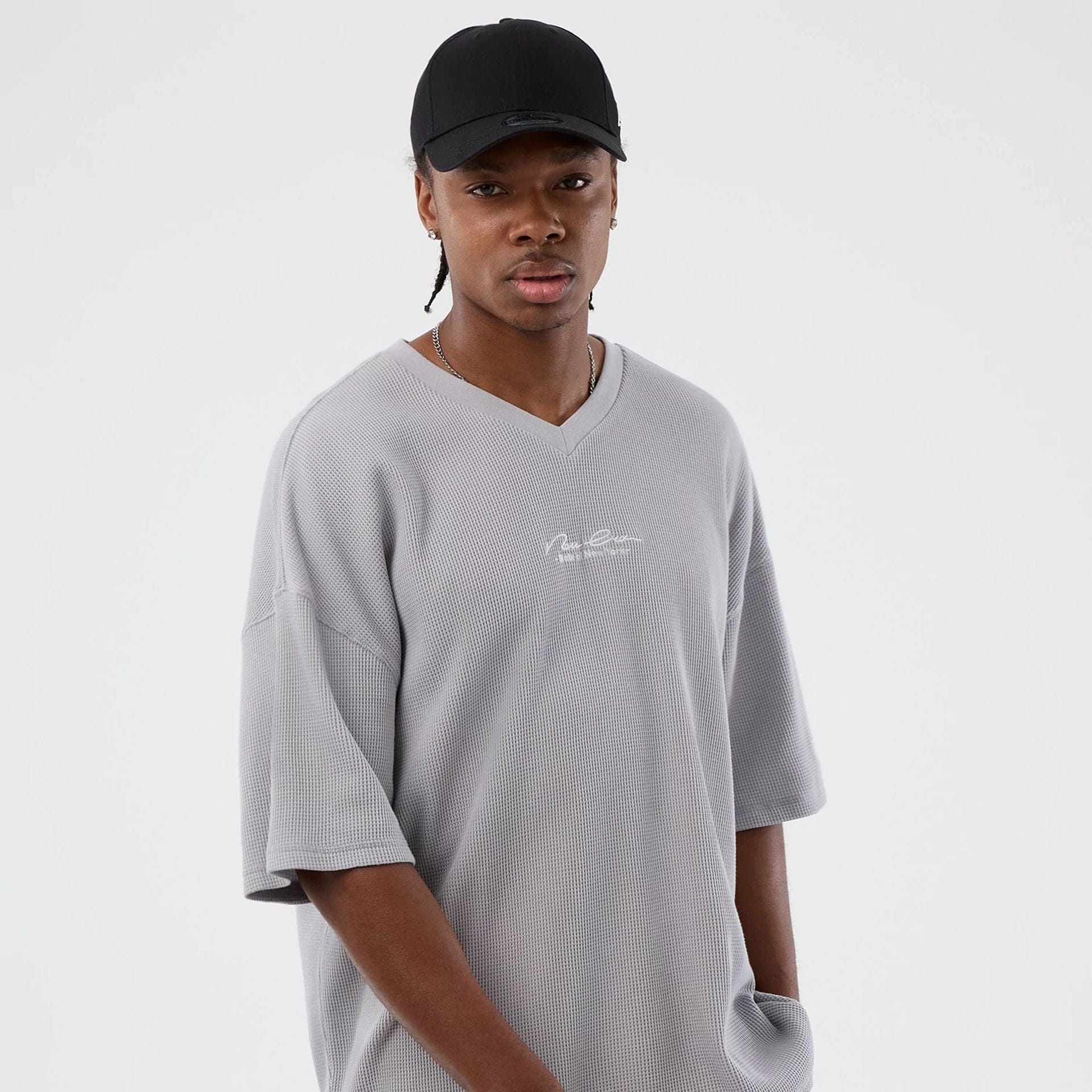 The Male model is wearing New Era Basic Grey T-Shirt 5