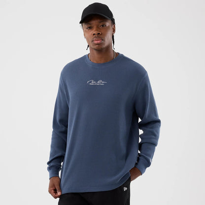 The Male model is wearing New Era Basic Blue Long Sleeve T-Shirt 1