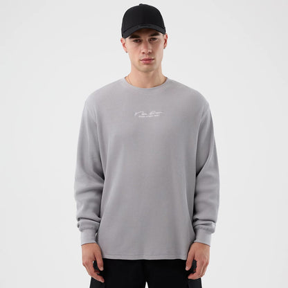 The Male model is wearing New Era Basic Grey Long Sleeve T-Shirt 1
