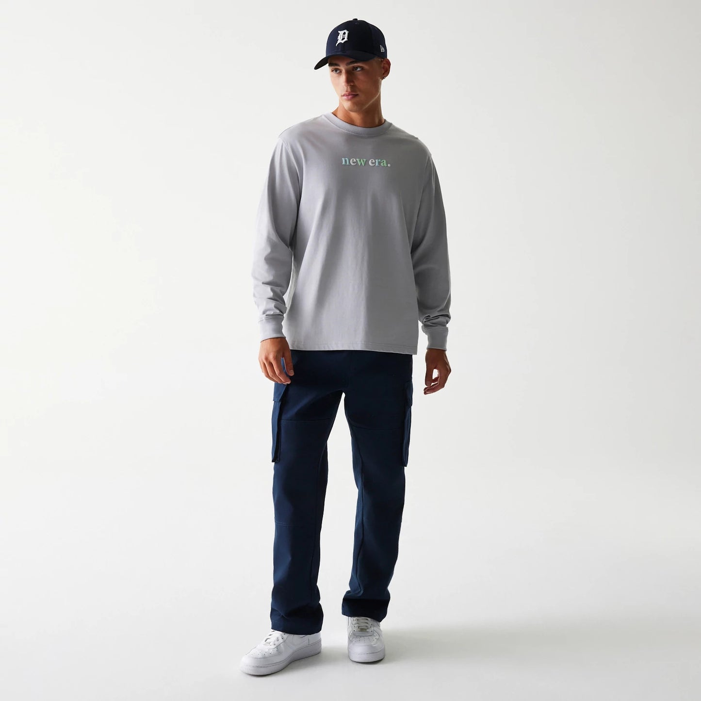 The Male model is wearing New Era 90s Vibe Grey Long Sleeve T-Shirt 3