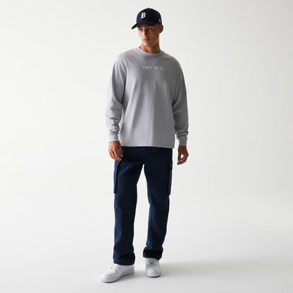 The Male model is wearing New Era 90s Vibe Grey Long Sleeve T-Shirt 3